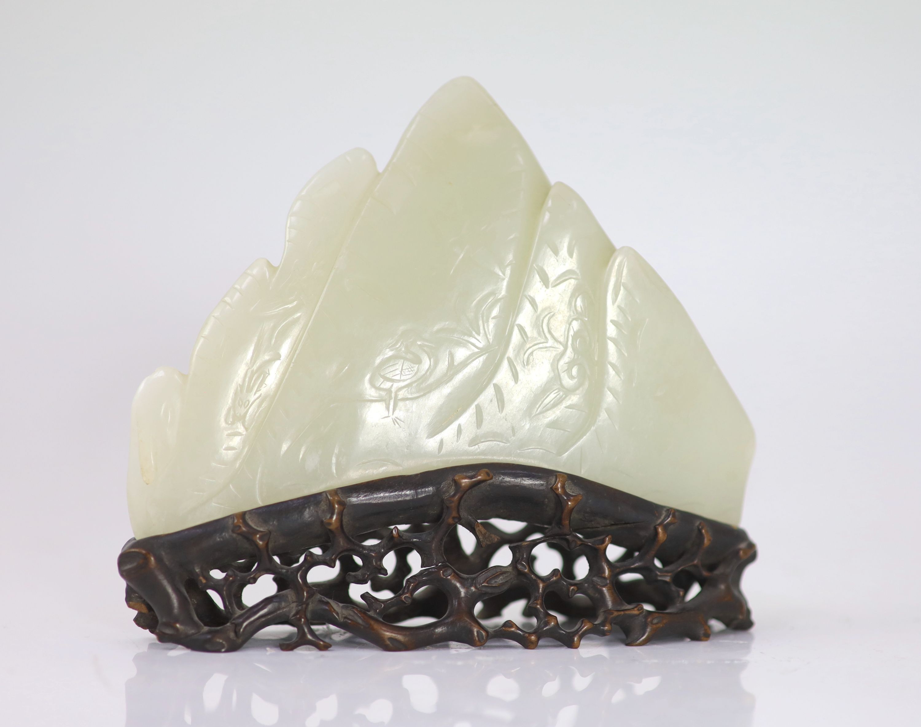 A  Chinese pale celadon jade carving of a mountain scene, 19th century,
